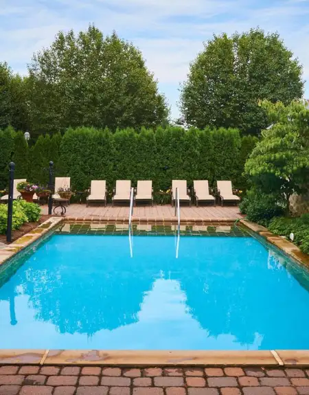 Outdoor pool with lounge chairs at Inn at Leola Village in Lancaster PA