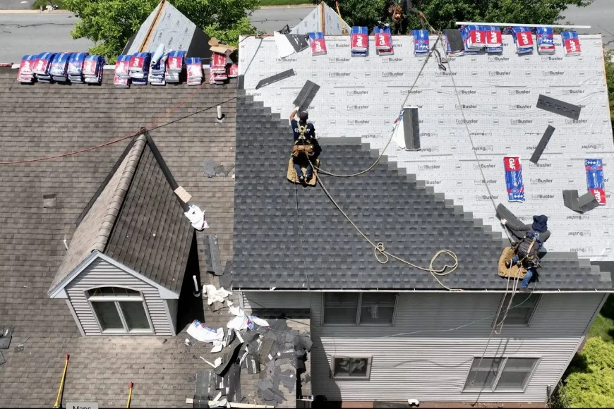 Joyland Roofing crew installing new shingles with safety harnesses on Lancaster PA residential roof
