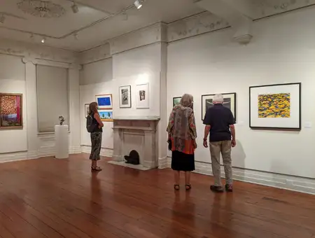 Lancaster Museum of Art gallery exhibition with visitors viewing local and regional artist paintings in Lancaster PA