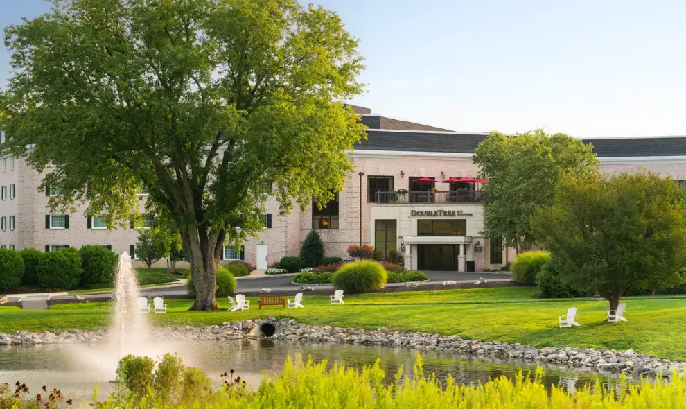 DoubleTree Resort by Hilton hotel exterior with pond and fountain in Lancaster PA