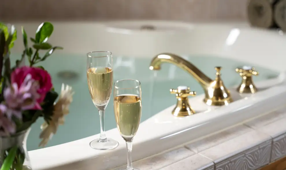 Romantic spa bathtub with champagne glasses at an inn in Intercourse Village Lancaster PA