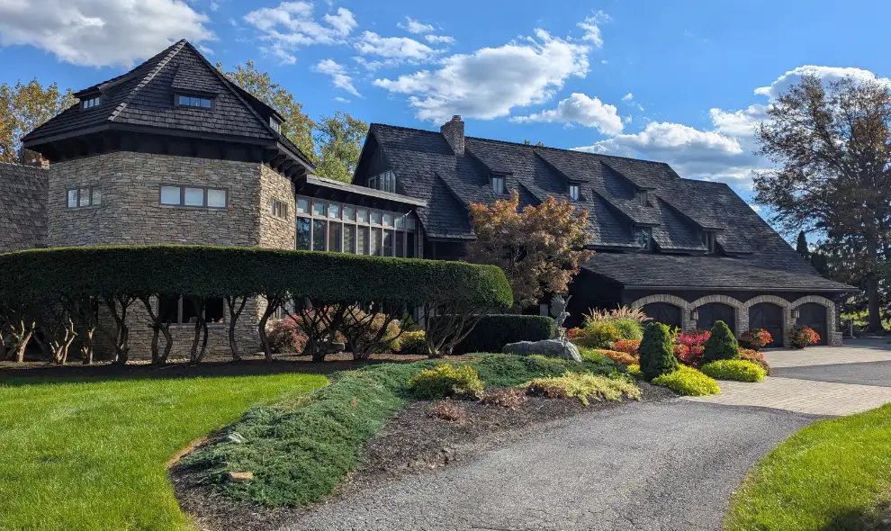 Twin Pine Manor stone and timber bed and breakfast exterior with landscaped grounds in Lancaster PA
