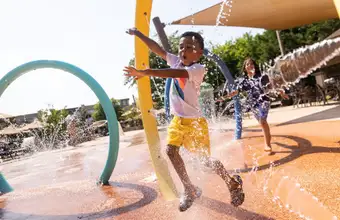 Kids playing in the splash pad water park at Eden Resort near Dutch Wonderland in Lancaster PA
