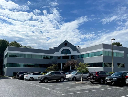 Our Town Management commercial office building exterior with parking lot in Lancaster PA