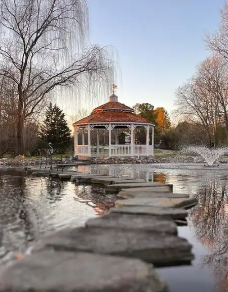 Ornate gazebo with pond and stepping stones at Fishers outdoor structures in Lancaster County PA