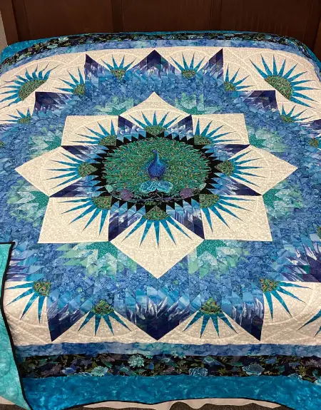Intricate Amish peacock star quilt for sale at Miller's quilt shop in Lancaster County PA
