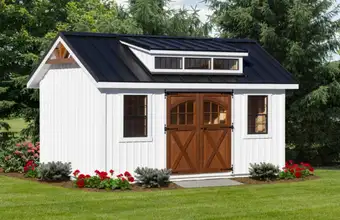 White Amish built storage shed with wood doors and dormer by Lancaster Barns in Lancaster County PA