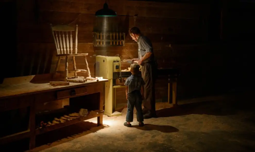Country Lane Furniture Amish craftsman woodworking in workshop with child - handcrafted furniture Lancaster PA