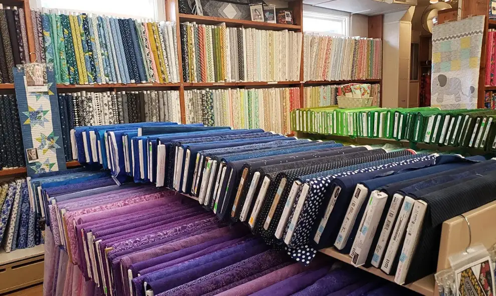 Old Country Store fabric and quilting supply shop with rows of colorful fabric bolts - Intercourse Lancaster PA