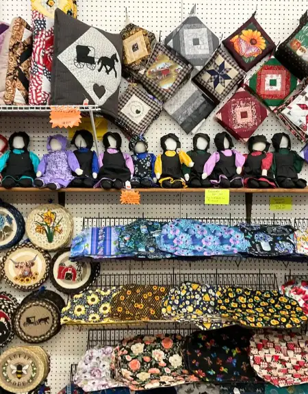 Amish faceless dolls quilted pot holders and handmade souvenirs at Bird in Hand Farmers Market Lancaster PA