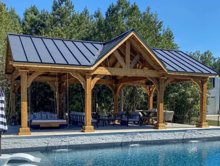 The Backyard Showcase Amish-built timber frame pavilion with metal roof beside pool in Lancaster PA