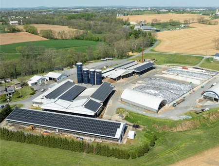 Twilight Renewables aerial view of commercial solar panel installation on large farm buildings in Lancaster PA