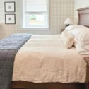 Vacation rental bedroom with rustic wood furnishings at Mill Creek Manor in Lancaster PA