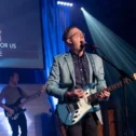 Victory Church Lancaster PA worship team performing on stage with guitars and stage lighting