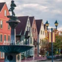 Fountain and colorful Bavarian style buildings at Stoudtburg Village in Adamstown PA