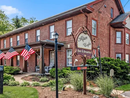 Brick exterior with American flags at After Eight Bed and Breakfast in Amish Country PA