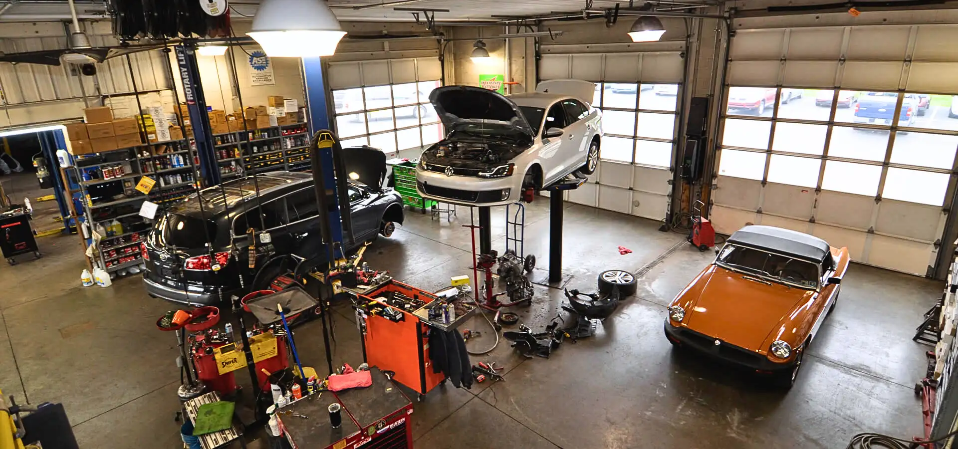 Auto repair bay with cars on lifts at Steffy's Garage in Lancaster PA