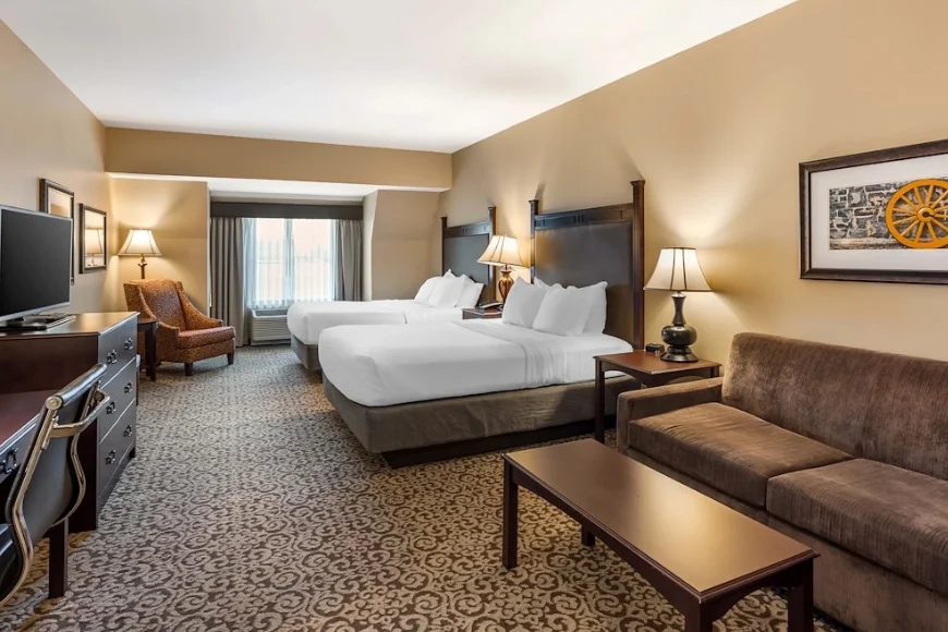 Hotel room with two queen beds and seating area at Best Western Plus Intercourse Village Inn in Lancaster PA