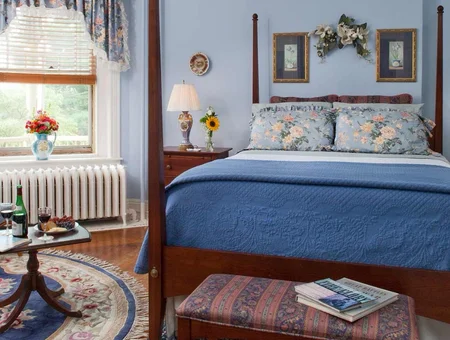Bedroom with four poster bed and wine service at B.F. Hiestand House Bed and Breakfast in Lancaster PA