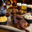 Smoked chicken platter with sides and beer flight at Smokehouse BBQ, Bird-in-Hand PA