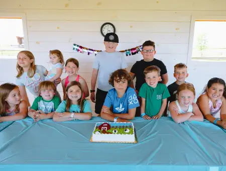 Cherry Crest Adventure Farm kids birthday party group photo with farm cake in Lancaster PA