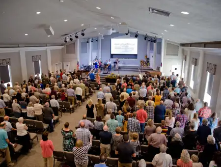 Calvary Bible Church congregation standing during worship service in Lancaster PA