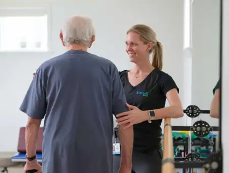 Landis at Home caregiver assisting senior patient with physical therapy in Lancaster PA