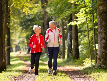 Senior couple jogging outdoors, DeverCare Insurance Group ad