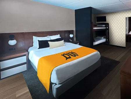 Hotel room with king bed and bunk beds for kids at Dutch Wonderland Inn in Lancaster PA