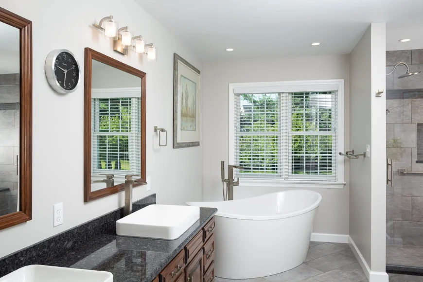Remodeled bathroom with freestanding soaking tub and walk-in tile shower by Earl Weaver Contractors in Lancaster County PA
