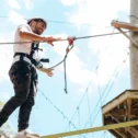 Person navigating a high ropes course at Refreshing Mountain in Ephrata PA