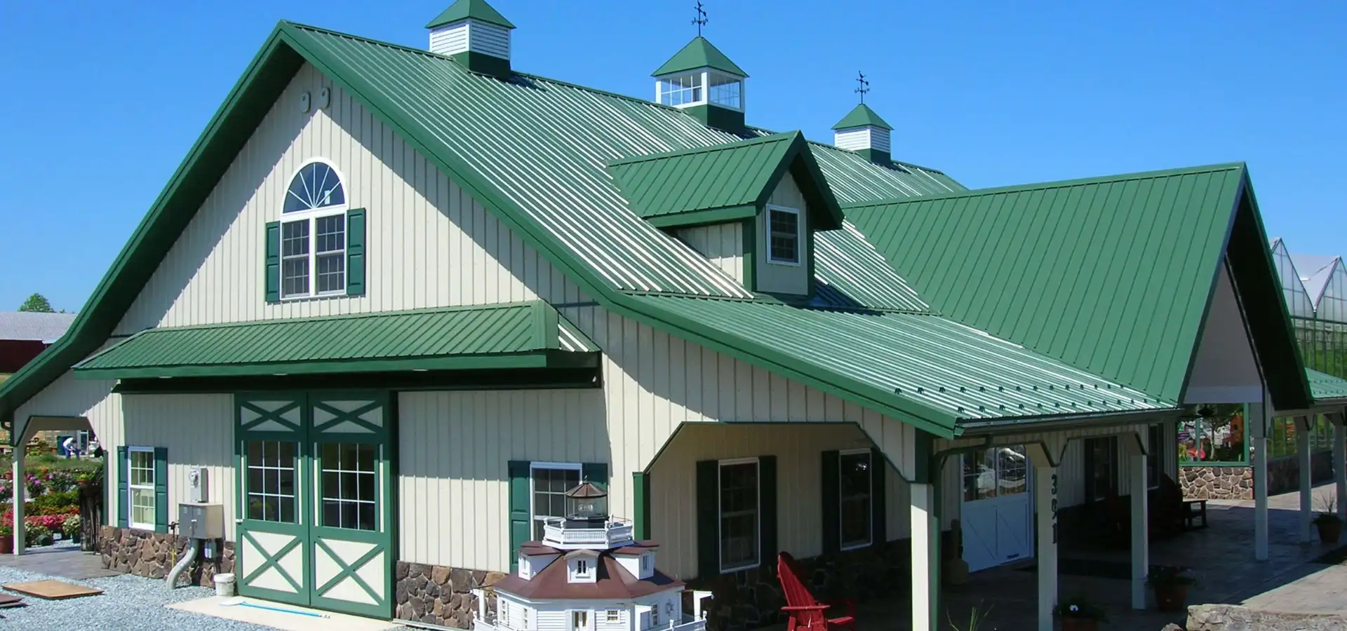 Green metal roof building with cupolas at Conestoga Buildings in Ephrata PA
