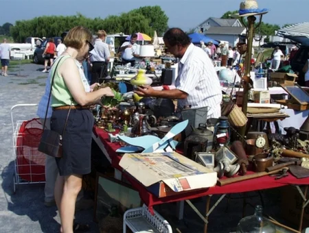 Roots Old Mill Flea Market outdoor vendor stand with antiques and collectibles in Lancaster PA