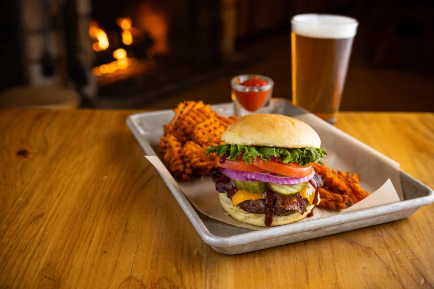 Cheeseburger with waffle fries and beer at Smokehouse at Plain & Fancy Farm in Lancaster PA