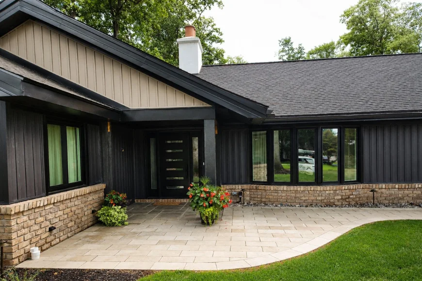 Modern black roofline and entrance with paver patio by Joyland Roofing in Lancaster PA