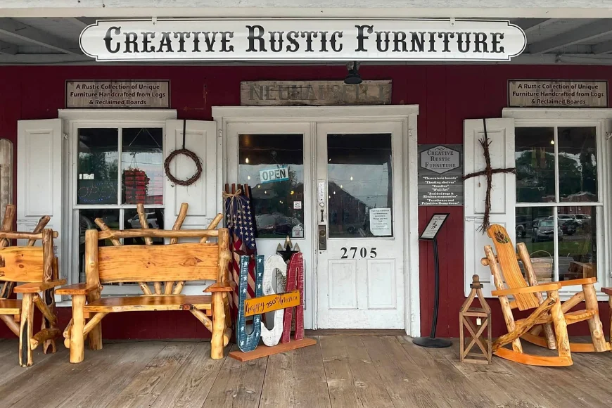 Storefront entrance with log bench and rocking chair at Creative Rustic Furniture in Lancaster PA