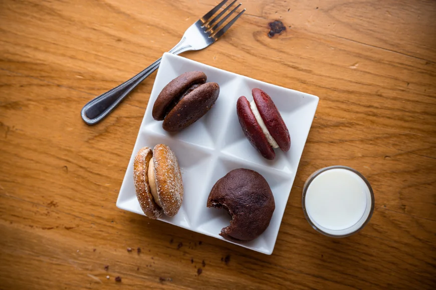 Assorted whoopie pies with milk at Smokehouse at Plain & Fancy Farm in Lancaster PA