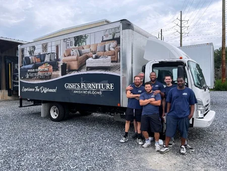 Gish's Furniture delivery truck with staff standing beside it, Amish heirloom furniture in Lancaster PA