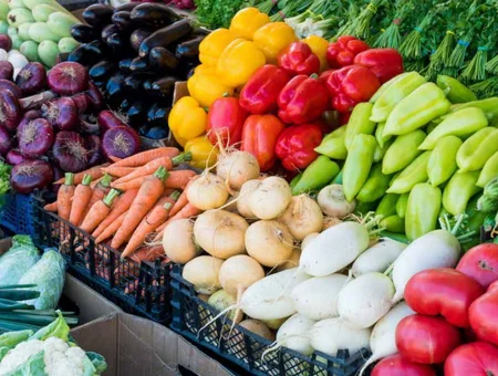 Fresh vegetables including peppers carrots eggplant and turnips at Green Dragon Farmers Market Lancaster PA