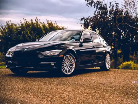 Susquehanna Insurance black BMW sedan parked on gravel lot in Lancaster PA