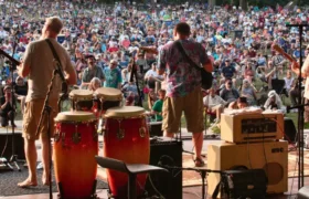 Band playing to a large lawn crowd at a Lancaster PA music festival