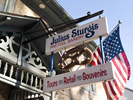 Julius Sturgis Pretzel Bakery sign with pretzel emblem and American flag in Lancaster PA