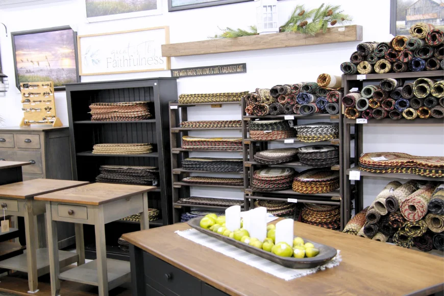 Store display of wood nightstands, woven rugs, and rustic home décor at King's Home Furnishings