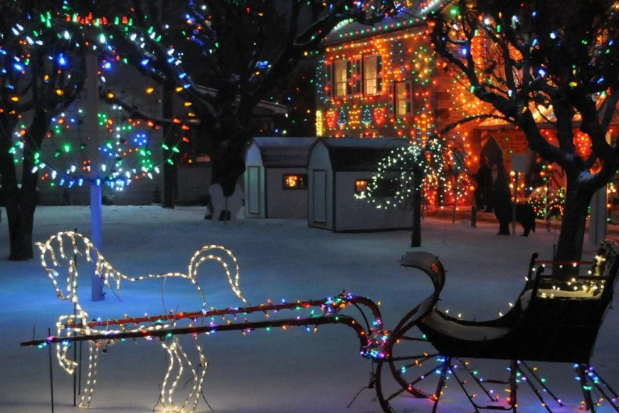 Lighted horse and sleigh display in snow at Koziar's Christmas Village in Lancaster PA