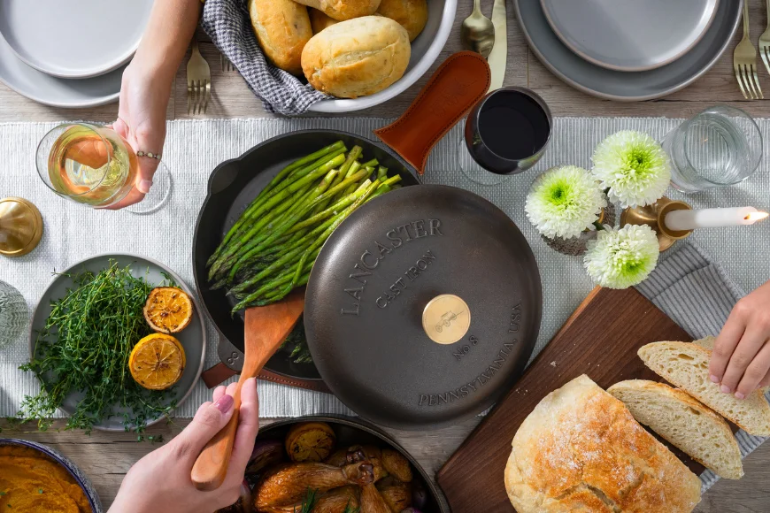 Overhead view of a farm table dinner with Lancaster Cast Iron cookware made in Pennsylvania