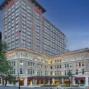 Lancaster Marriott at Penn Square exterior at dusk in Lancaster, PA, with the historic Soldiers and Sailors Monument statue in front