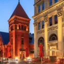 Historic brick building in downtown Lancaster PA with outdoor cafe seating at dusk