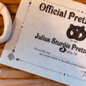 Handmade soft pretzel next to an Official Pretzel Twister certificate from Julius Sturgis Pretzel Bakery, the oldest pretzel bakery in America, in Lititz, PA