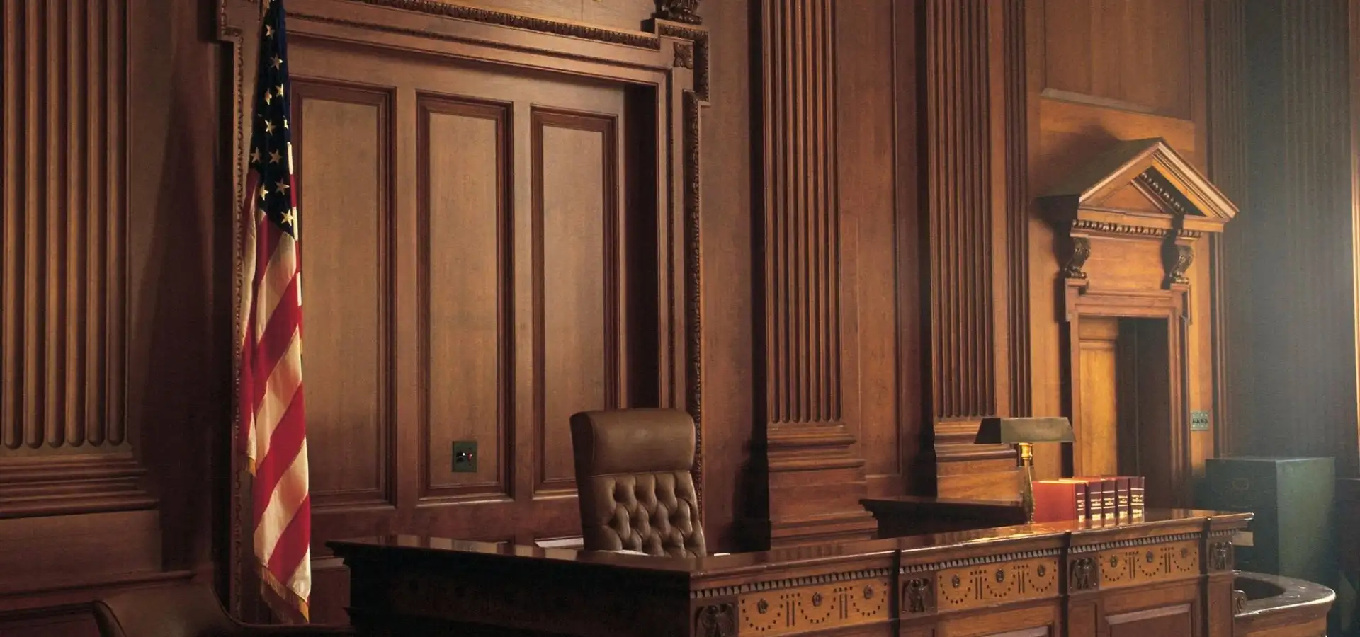 Judge's bench with empty chair and American flag for Goodman Kenneff law firm in Lancaster PA