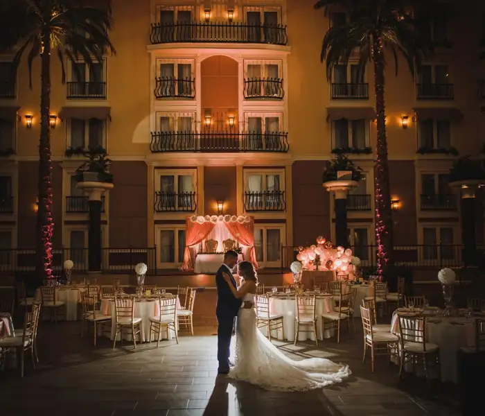 Bride and groom embracing at courtyard wedding reception at DoubleTree in Lancaster PA